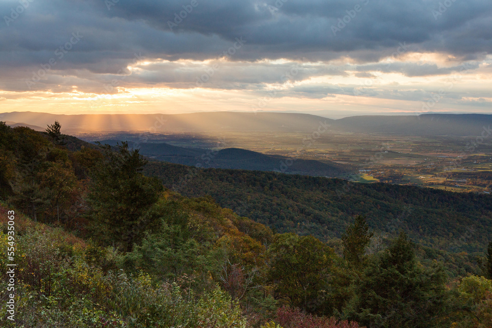 Sun rays breaking through storm clouds over Shenandoah National Park.; Virginia, United States of America Sun rays breaking through storm clouds over Shenandoah National Park.; Virginia, United States of America
