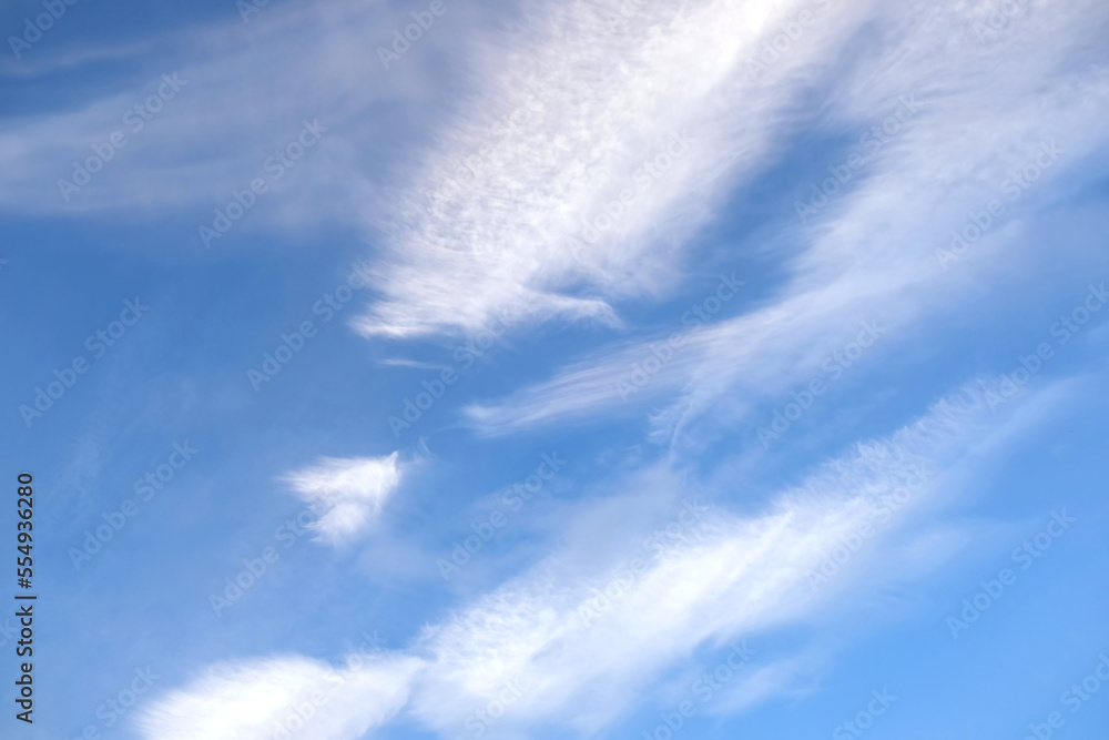 Beautiful sky landscape with white calm soft fluffy spindrift clouds high in the stratosphere on a sunny serenite day