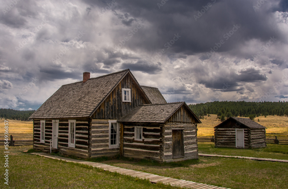 Log Cabins in the Colorado High Country Beneath Stormy Skies Log Cabins in the Colorado High Country Beneath Stormy Skies