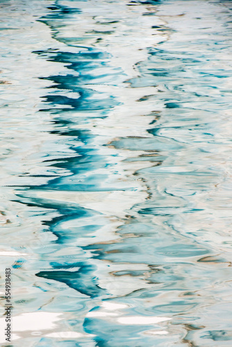 Abstract patterns on a watery surface with icy and wavy reflections; South Georgia Island, Antarctica