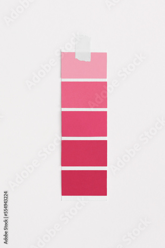 Color swatches with color of the year 2023 - Viva Magenta. Color trend palette. Top view, flat lay.