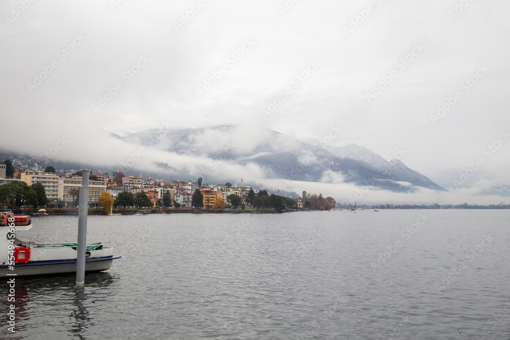 Amazing foggy landscape of Locarno with clouds and mountains