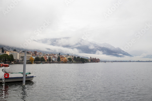 Amazing foggy landscape of Locarno with clouds and mountains