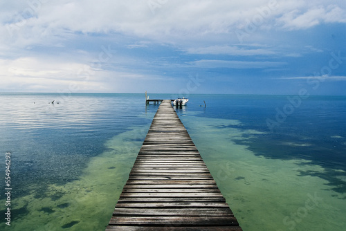 A dock leading to the horizon in Cay Caulker.; Cay Caulker, Belize. photo