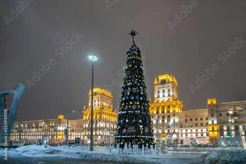 Christmas tree in Minsk ( Belarus)   and   view on Buildings and blurred from motion people  blurred motion