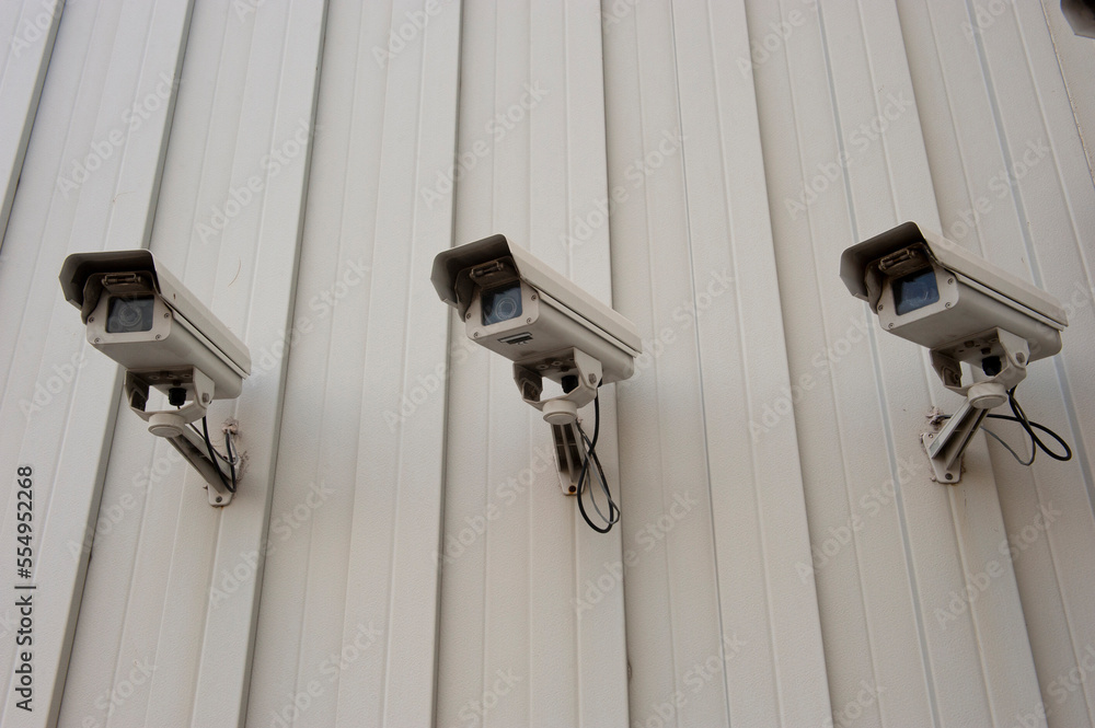 Surveillance cameras on the exterior of a business; Houston, Texas, United States of America Surveillance cameras on the exterior of a business; Houston, Texas, United States of America