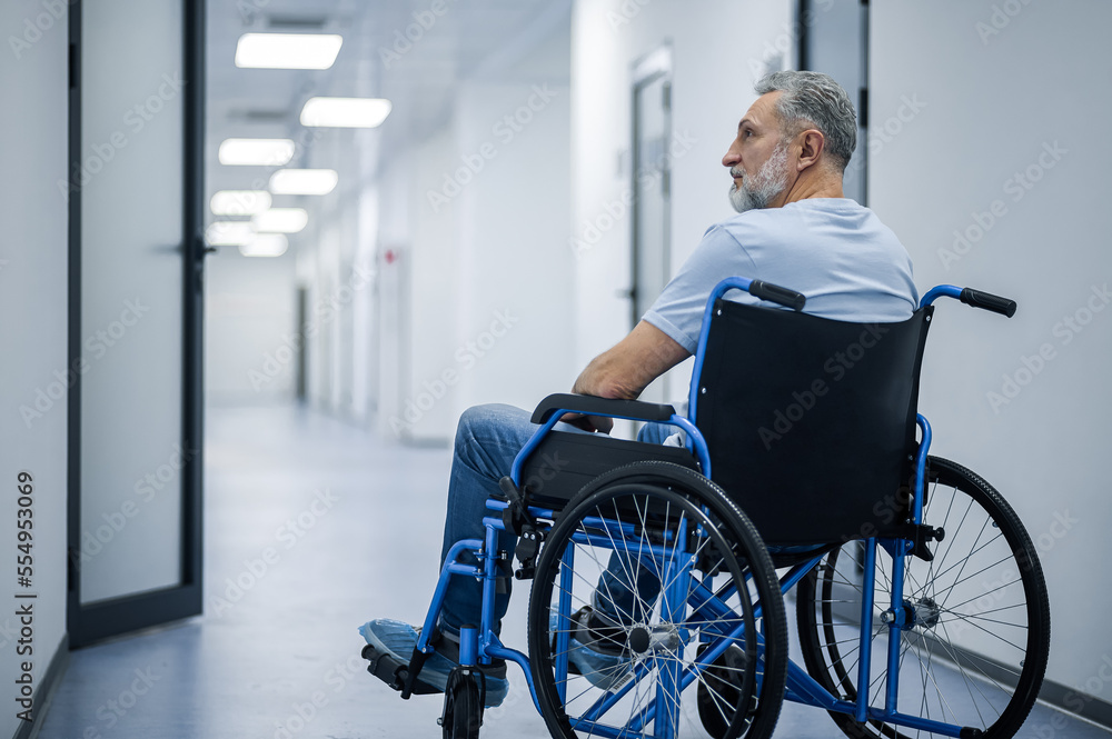 Disabled man in a wheelchair in a rehabilitation center Disabled man in a wheelchair in a rehabilitation center