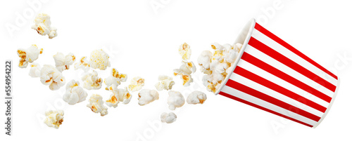 Flying popcorn from red striped paper cup, isolated on white background