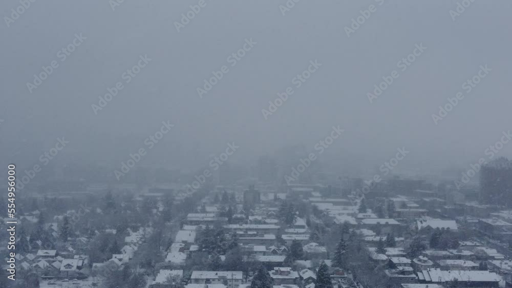Fog and snow aerial view of Vancouver neighbourhood disappear on a horizon Fog and snow aerial view of Vancouver neighbourhood disappear on a horizon