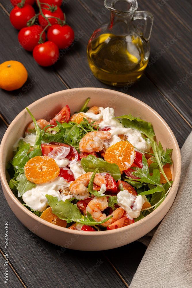 Fresh light salad with arugula, shrimp, tangerines, strachatella cheese, cherry tomatoes Fresh light salad with arugula, shrimp, tangerines, strachatella cheese, cherry tomatoes