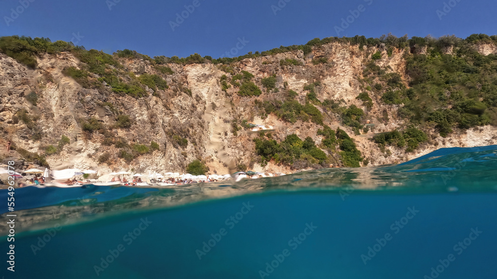 Underwater split sea level photo of famous paradise beach of Agiofili in island of Lefkada, Ionian, Greece