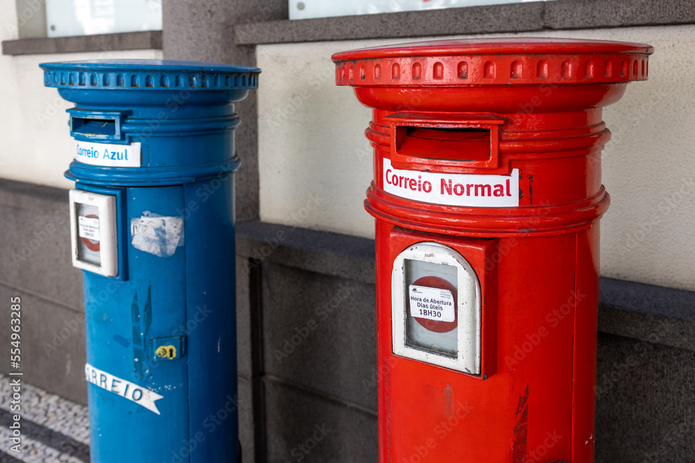 Funchal, Madeira, Portugal - August 5 2022: Two portuguese mailboxes on the street in Funchal Funchal, Madeira, Portugal - August 5 2022: Two portuguese mailboxes on the street in Funchal