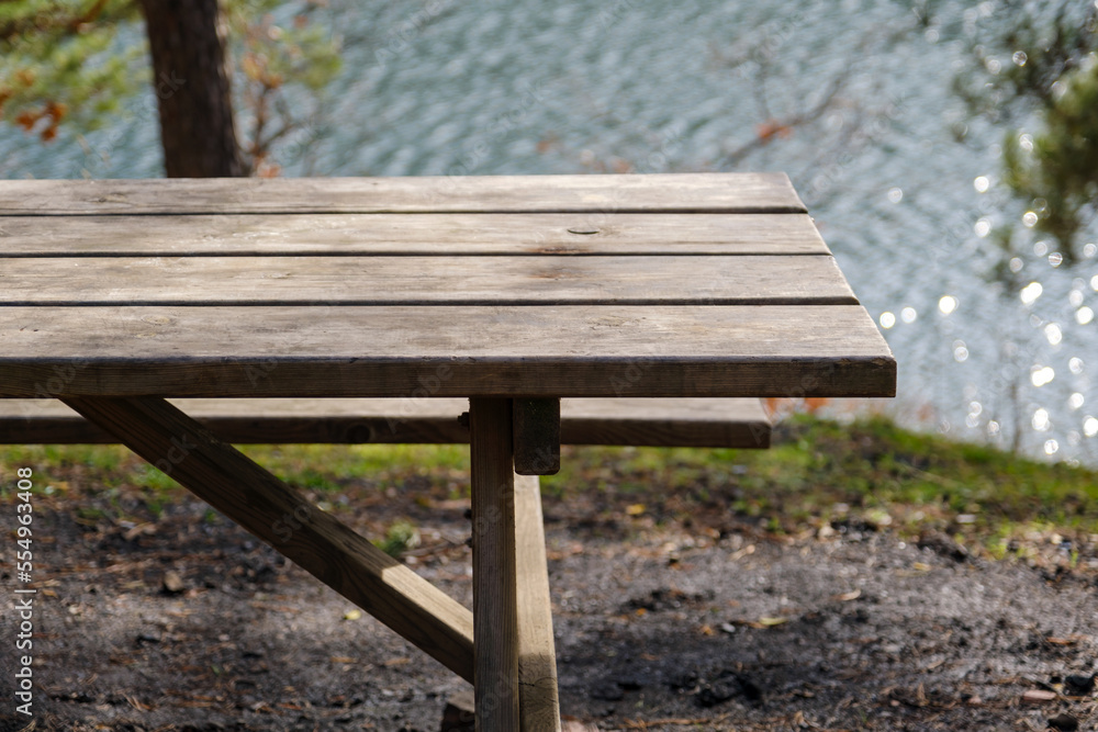 wooden table by the lake