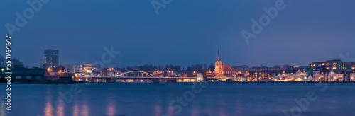 Obraz na płótnie Evening cityscape of Sonderborg (Dan. Sønderborg), city in Southern Denmark. Night skyline city lights wide panorama w salonie