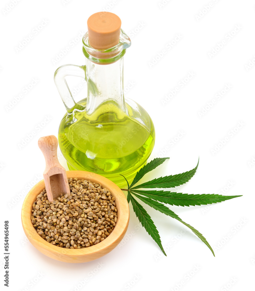 Hemp oil in glass bottle and fresh green hemp leaves. Hemp oil in glass bottle and fresh green hemp leaves.