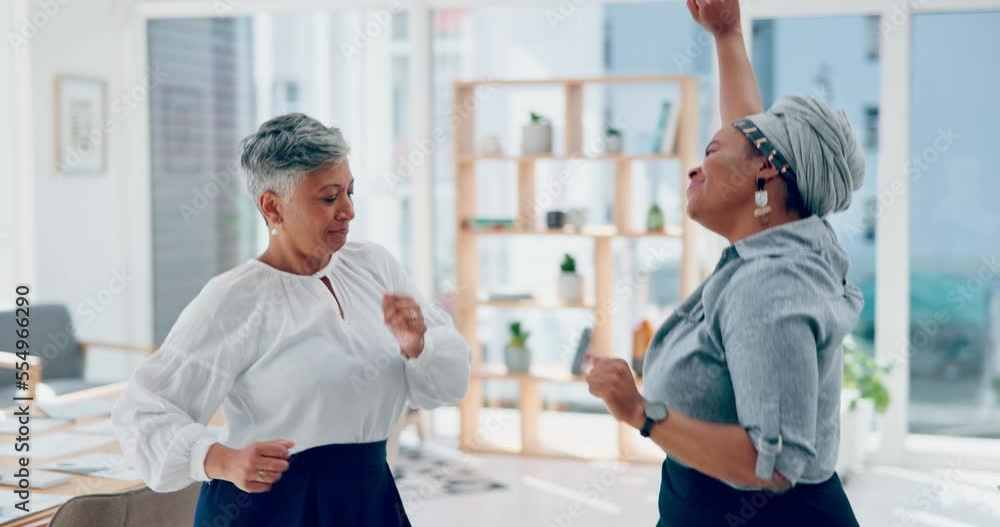 Business women, dancing and celebration in office for success, target achievement and bonus while doing happy dance together. Female employees or friends celebrate teamwork, growth and development Business women, dancing and celebration in office for success, target achievement and bonus while doing happy dance together. Female employees or friends celebrate teamwork, growth and development