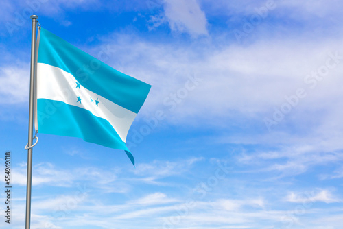 Republic of Honduras flags over blue sky background. 3D illustration