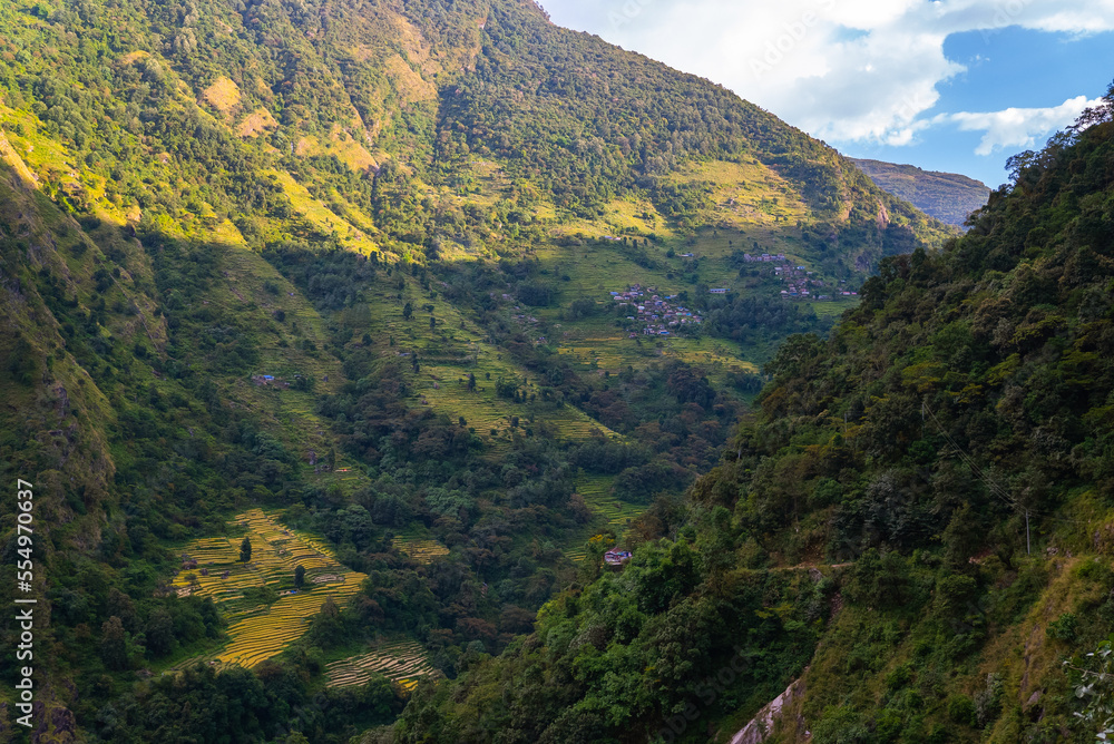 Naklejka premium Farm terraces in the himalayan moutains and valleys on the Annapurna Circuit Trek, Nepal