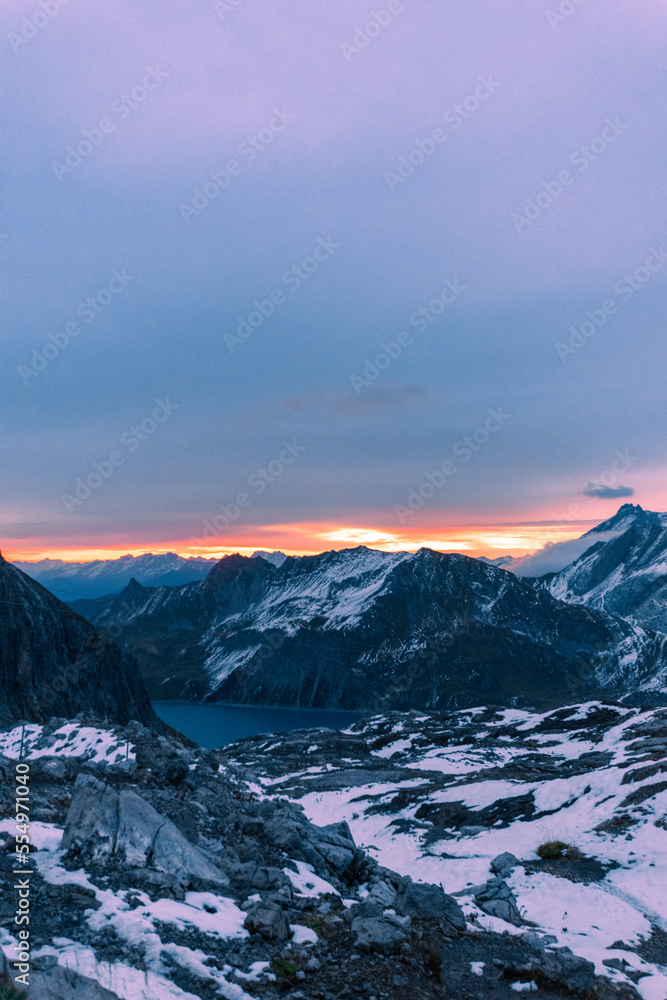 sunrise over the snowy mountains during spring (Lünersee, Vorarlberg, Austria)