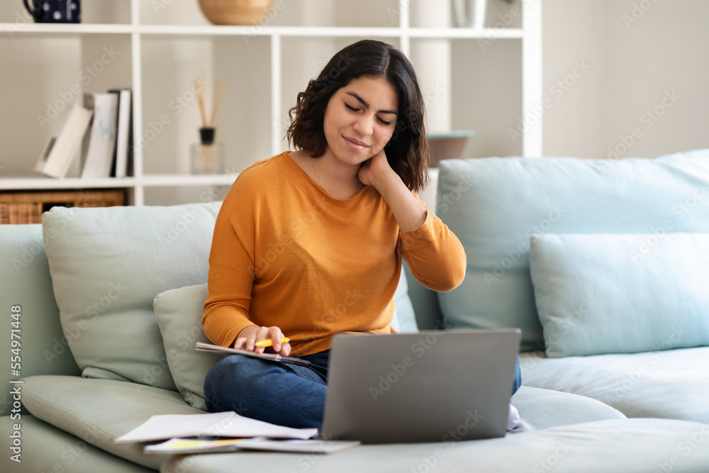 Young Arab Woman Suffering Neck Pain While Working With Laptop At Home Young Arab Woman Suffering Neck Pain While Working With Laptop At Home