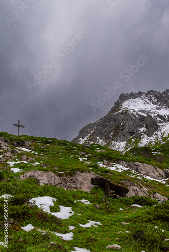 wooden cross on a cloudy day in the alps (Lünersee, Vorarlberg, Austria)