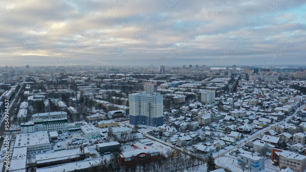 19.12.2022: Panoramic view of winter Minsk. Megapolis in the cold under the cover of snow. The capital of Belarus in winter. Vostok microdistrict in Minsk in winter.