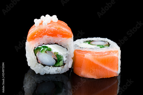 Sushi rolls California with shrimp, salmon, cream cheese and cucumber.