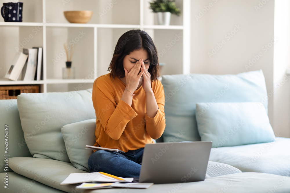 Stressed Young Arab Woman Feeling Tired While Study With Laptop At Home Stressed Young Arab Woman Feeling Tired While Study With Laptop At Home