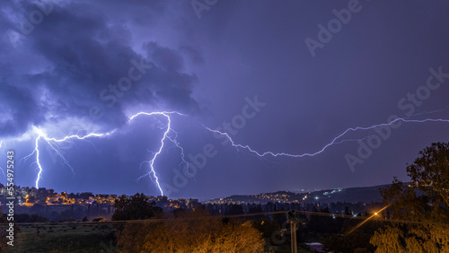Two big and glorious lightnings that fell across the city at night.