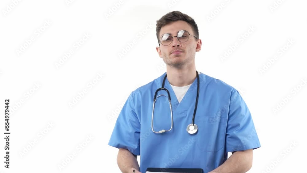 Doctor or nurse thinks before writing about the diagnosis holding a notebook in his hands on a white background. The concept of medical staff at work. Doctor or nurse thinks before writing about the diagnosis holding a notebook in his hands on a white background. The concept of medical staff at work.