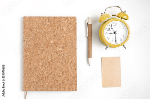 alarm clock, notepad for writing, pen, credit card on white background. Planing koncept. Yop view. Biznes koncept photo