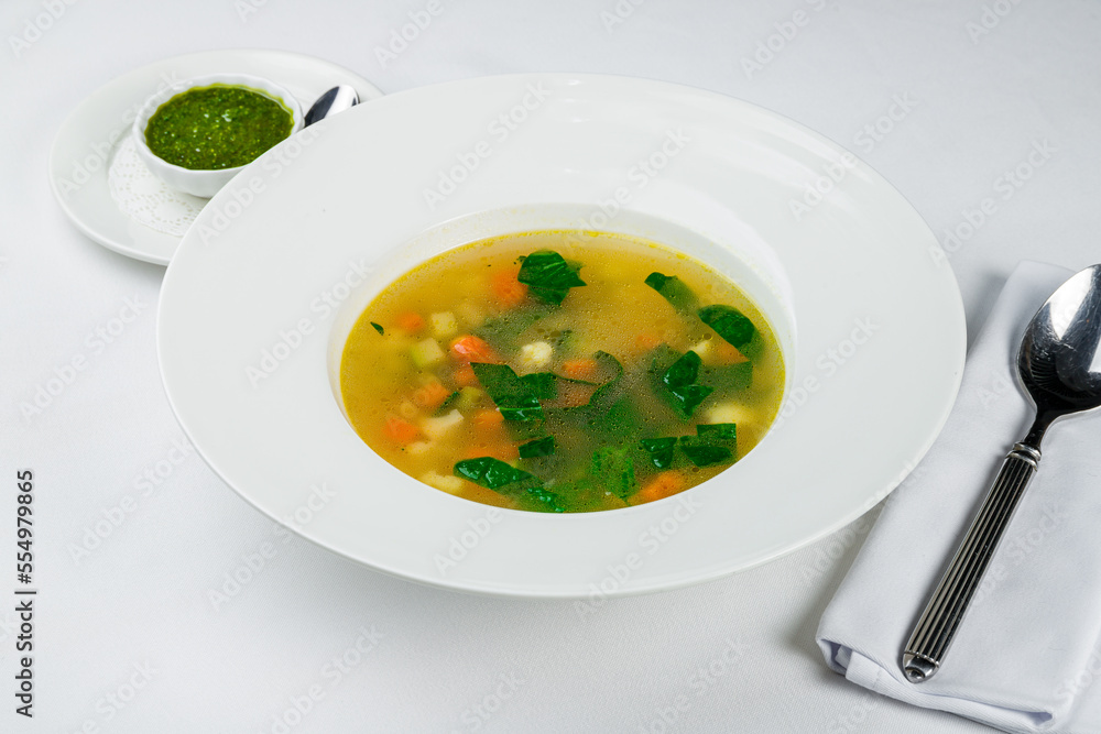 Vegetable soup minestrone on a white plate Vegetable soup minestrone on a white plate