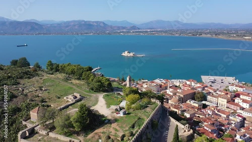 Aerial drone video from picturesque and famous fortress of Acronafplia with views to iconic city of Nafplio former capital of Greece, Argolida, Peloponnese  photo
