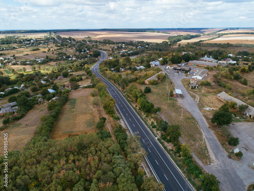 Aerial view asphalt road and green forest, Forest road going through forest with car adventure view from above, Ecosystem and ecology healthy environment concepts and background.