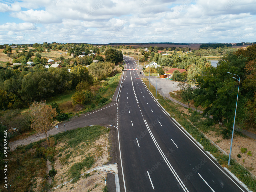 Obraz premium Aerial view asphalt road and green forest, Forest road going through forest with car adventure view from above, Ecosystem and ecology healthy environment concepts and background.