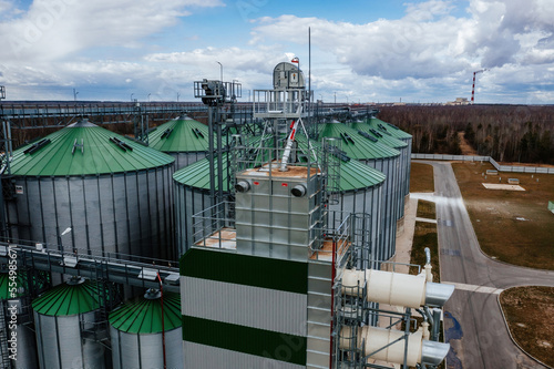Automatic agricultural grain dryer and silos, aerial view. Modern complex for drying, cleaning and storage grain