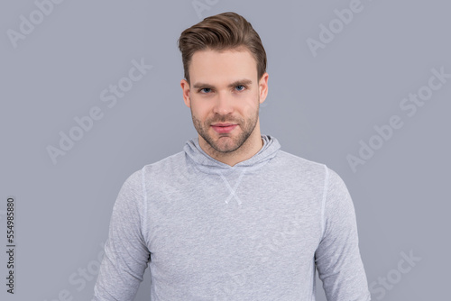 Portrait of man. Young man with unshaven face. Handsome man studio. Caucasian man in casual