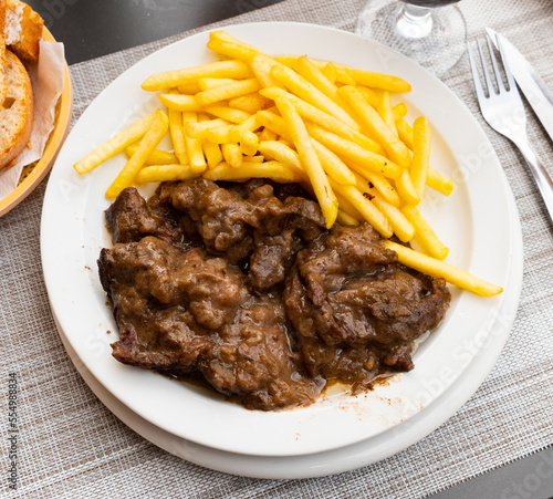 Appetizing French dish is Beef bourguignon, made from appetizing meat with wine and served with French fries
