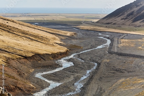 Hiking in Iceland, rugged valleys, black sediment