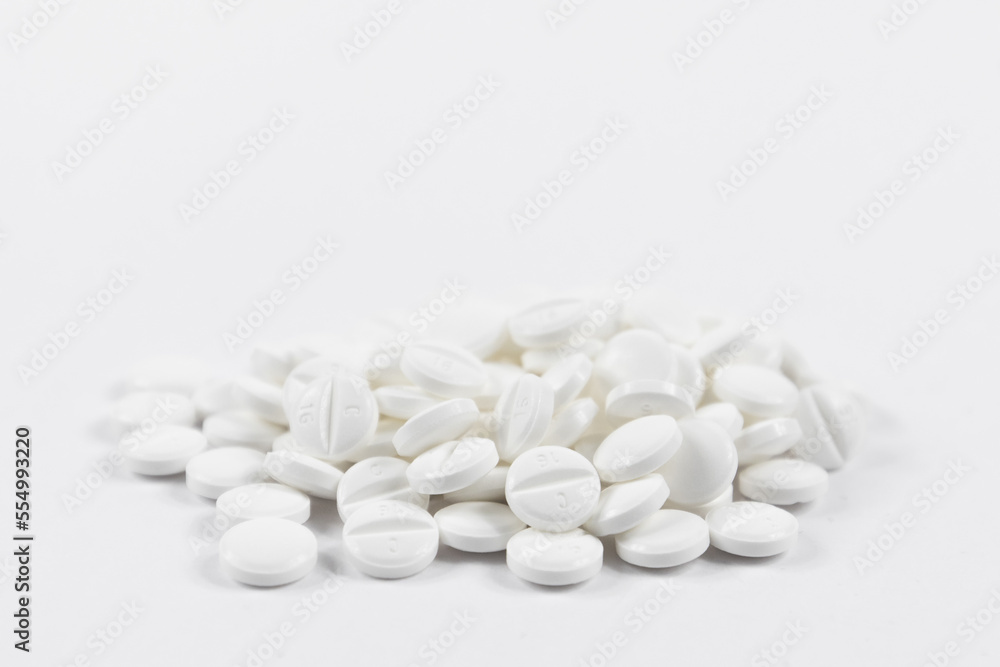 many white round medical tablets for humans and animals, medicinal antibiotics pills medicine closeup many white round medical tablets for humans and animals, medicinal antibiotics pills medicine closeup