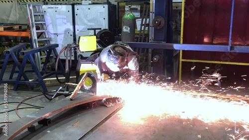 Welding metal, a lot of bright sparks when welding