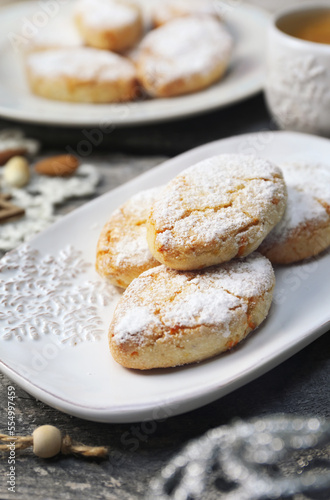 Ricciarelli, gluten free almond cookies. Italian traditional Christmas cookies and coffee. New year decor