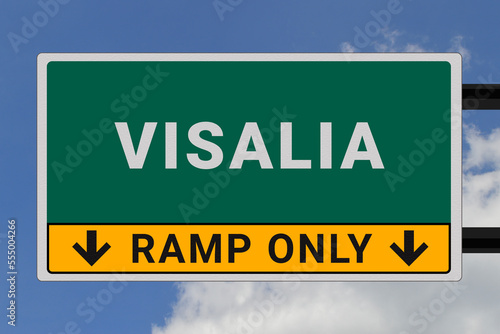 Visalia logo. Visalia lettering on a road sign. Signpost at entrance to Visalia, USA. Green pointer in American style. Road sign in the United States of America. Sky in background photo