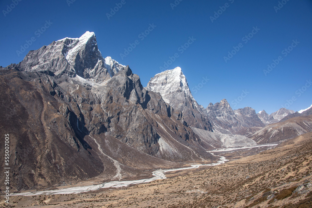 Trekking to Everest Base Camp under Cholatse and Taboche peaks, Khumbu, Nepal. Trekking to Everest Base Camp under Cholatse and Taboche peaks, Khumbu, Nepal.