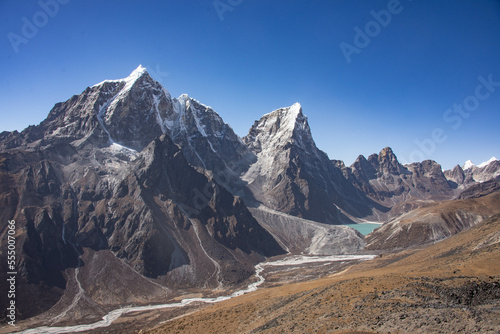 Trekking to Everest Base Camp under Cholatse and Taboche peaks, Khumbu, Nepal.