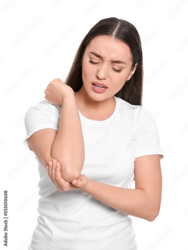 Young woman suffering from pain in elbow on white background. Arthritis symptoms Young woman suffering from pain in elbow on white background. Arthritis symptoms