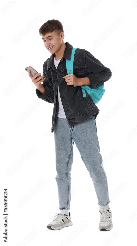 Teenage boy with backpack using smartphone on white background Teenage boy with backpack using smartphone on white background