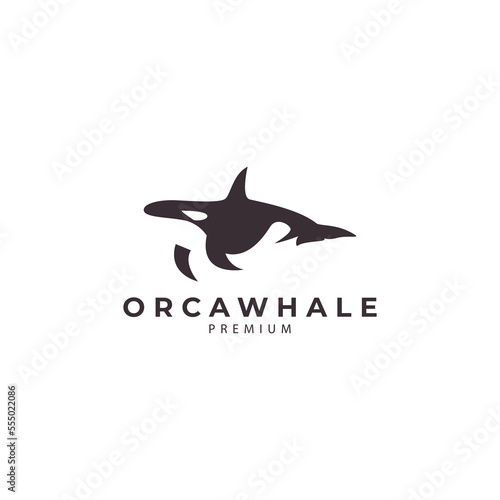 silhouette of orca whale sea mammal swimming ocean logo design vector icon illustration
