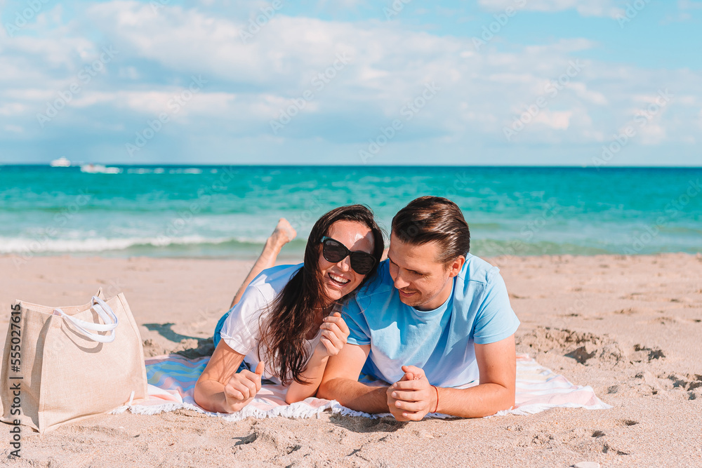 Fototapeta premium Young couple spending time together on the beach