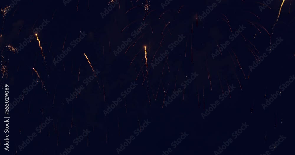 Fireworks display celebration for New year's eve with abstract multicolor big shining glowing fireworks show with bokeh lights in the night sky. 4KDCI Fireworks display celebration for New year's eve with abstract multicolor big shining glowing fireworks show with bokeh lights in the night sky. 4KDCI